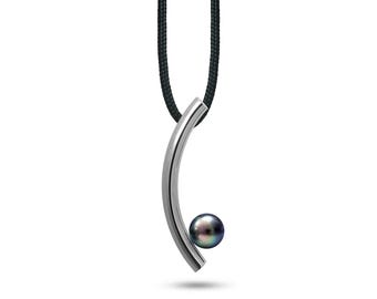 CURVE tubular curved vertical pendant with black pearl in stainless steel