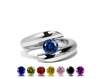 ONDE Bypass ring with tension set colored gemstone in stainless steel