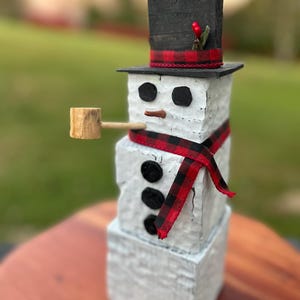 Rustic wooden snowman