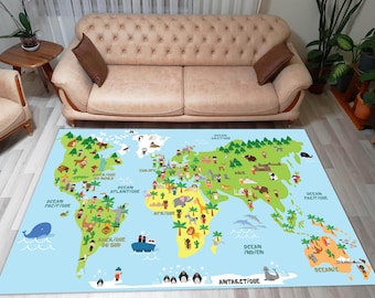 May include: A colorful world map rug with illustrations of animals and people from different continents. The rug is blue with green, brown, and yellow accents. The text on the rug includes "Ocean Pacifique", "Ocean Atlantique", "Europe", "Afrique", "Ocean Indien", "Antarctique", and "Oceanie".