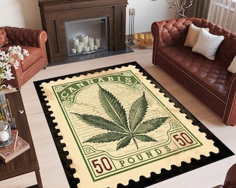 May include: A rectangular area rug with a cannabis leaf design. The rug is designed to look like a postage stamp, with the word "CANNABIS" at the top and "50 POUNDS" at the bottom. The rug is black with a cream-colored background.
