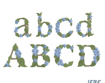 Può includere: Ricamo con font floreale con lettere minuscole e maiuscole a, b, c e d. Le lettere sono decorate con foglie verdi e fiori blu. Il design include sei misure, da 3,8 cm a 10,2 cm.