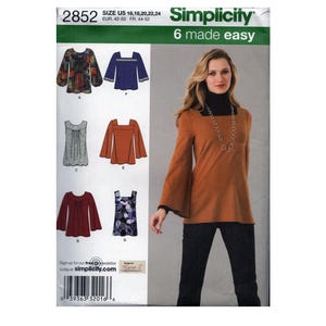 May include: Simplicity sewing pattern 2852 for tops in sizes US 16-24. The envelope features illustrations of six different blouse designs with various necklines and sleeve lengths, including floral, solid, and geometric patterns.