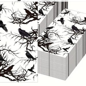 May include: Black and white wrapping paper with a repeating pattern of crows and bare branches. The paper is stacked in a pile.