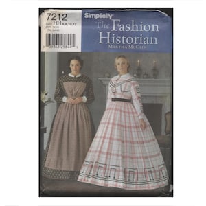 May include: Simplicity sewing pattern 7212, featuring two women in historical dresses. The pattern is titled "The Fashion Historian" by Martha McCain. The dresses are long, with detailed bodices and skirts, showcasing vintage fashion.