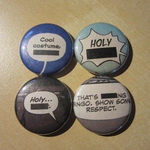 May include: Four round buttons with comic book style speech bubbles. The buttons are blue, light blue, black, and white. Text includes "Cool costume," "HOLY," "Holy...", and "THAT'S BINGO. SHOW SOME RESPECT."