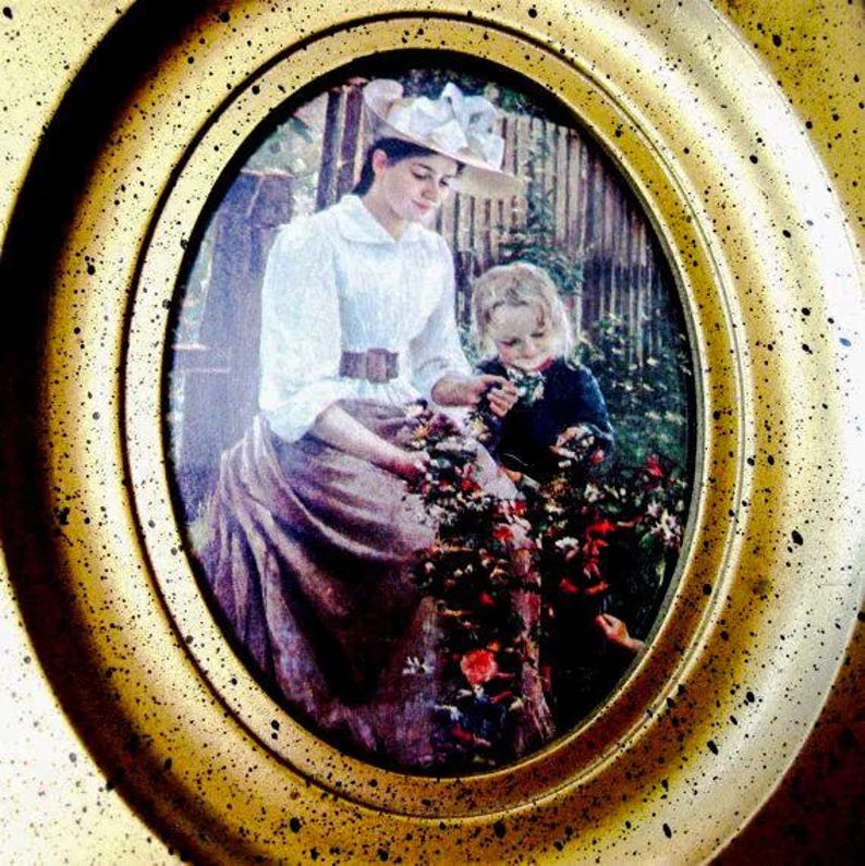 May include: A framed painting of a woman in a white dress and hat holding a bouquet of flowers with a young girl in a blue dress standing next to her.