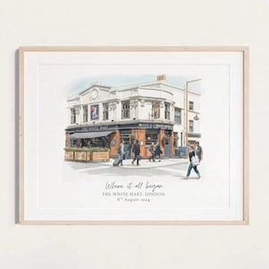May include: Watercolor print of The White Hart pub in London, England. The building is white with a blue awning and signage. The print includes the text "Where it all began" and the date "8th August 2024". People are walking on the sidewalk.