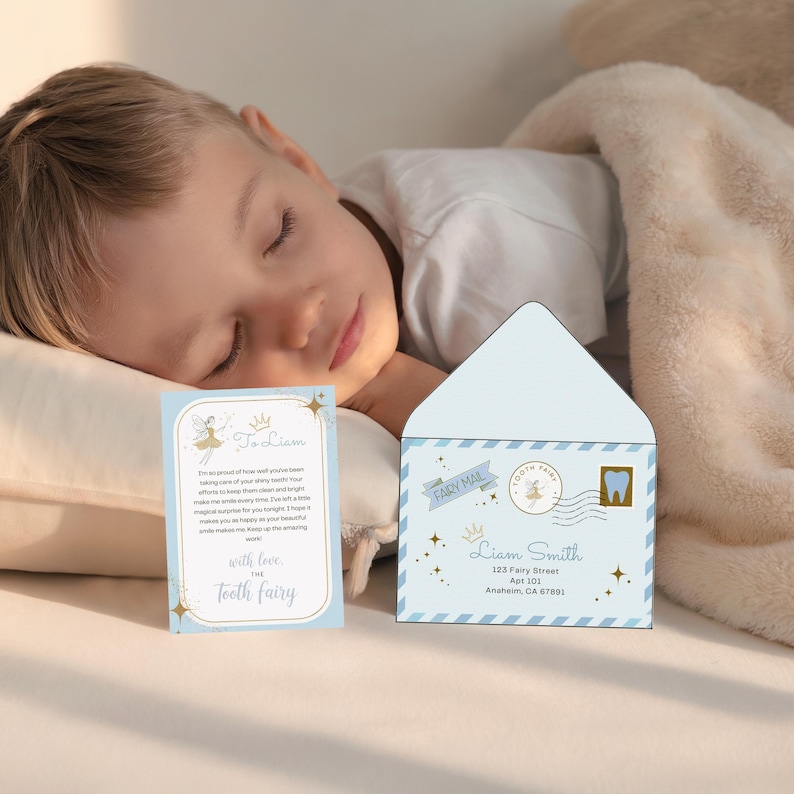 May include: A light blue Tooth Fairy envelope and card set. The envelope features a tooth stamp and the words "Fairy Mail." The card reads "To Liam" and includes a message from the Tooth Fairy. The set is decorated with stars and crowns.