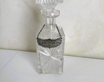 Decantador de licor antiguo con etiqueta histórica de bourbon Newport de Stieff Pewter
