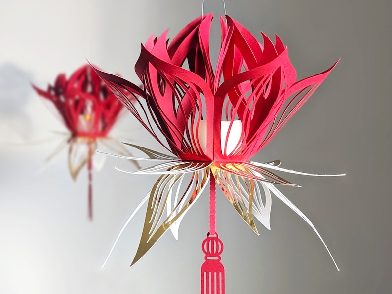 Red and gold 3D paper lotus lantern with tassel, made from an SVG template for Cricut; hanging Lunar New Year lotus flower decor.
