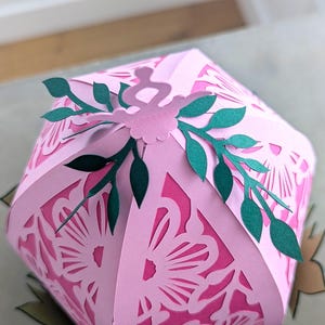 Close up of the top of Easter egg craft, showing paper leaves.