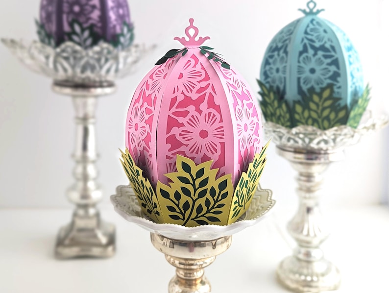 Easter Egg Baskets in the shape of eggs, sitting in a leaf patterned basket. Cricut SVG file.