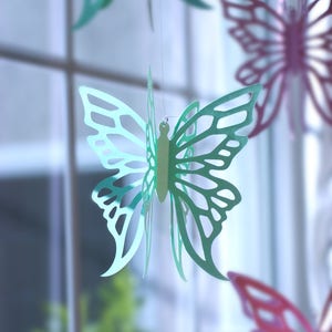 Paper Butterflies hanging in window