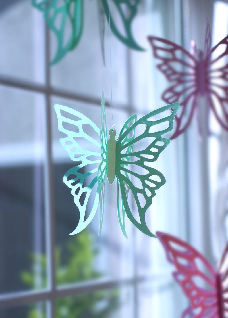 Paper Butterflies hanging in window