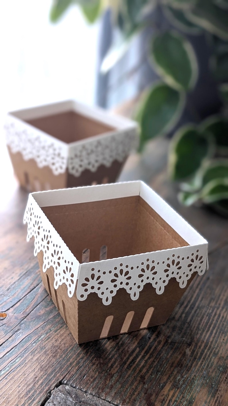 Lace berry basket made from kraft cardstock with white lace edge detail, empty paper treat box styled on wooden table