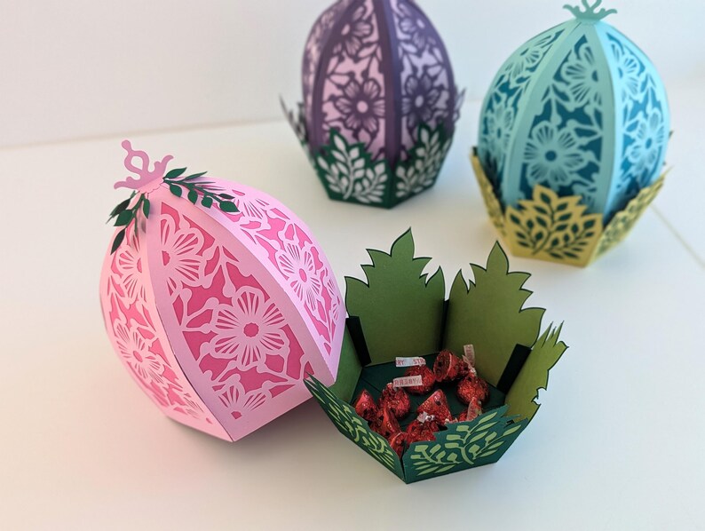 Easter egg with treats inside. Egg opens up to reveal a leaf basket of chocolates. Great for easter gifts.