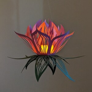 Pink paper lotus lantern glowing with LED light hanging decor
