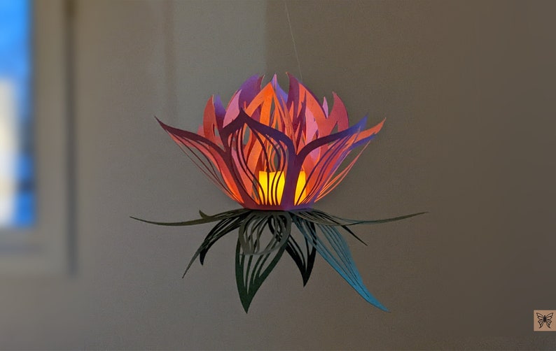 Pink paper lotus lantern glowing with LED light hanging decor