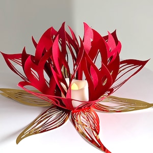 Red and gold 3D paper lotus centerpiece with a glowing LED tealight, made from a lotus lantern SVG for Cricut and Silhouette.
