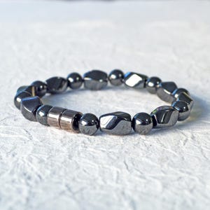 Magnetic bracelet for men handcrafted with high power black hematite magnetic beads. Bracelet is secured with a strong and easy-to-use magnetic clasp.
