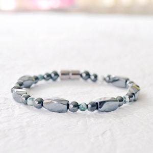 Magnetic bracelet handcrafted with black high power magnetic hematite beads and tree agate gemstone beads. Secured with a strong magnetic clasp. Wear as a magnetic bracelet or magnetic ankle bracelet.