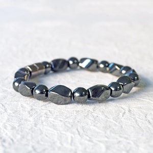 Magnetic bracelet for men handcrafted with high power black hematite magnetic beads. Bracelet is secured with a strong and easy-to-use magnetic clasp.