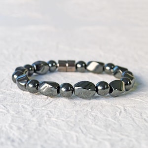 Magnetic bracelet for men handcrafted with high power black hematite magnetic beads. Bracelet is secured with a strong and easy-to-use magnetic clasp.