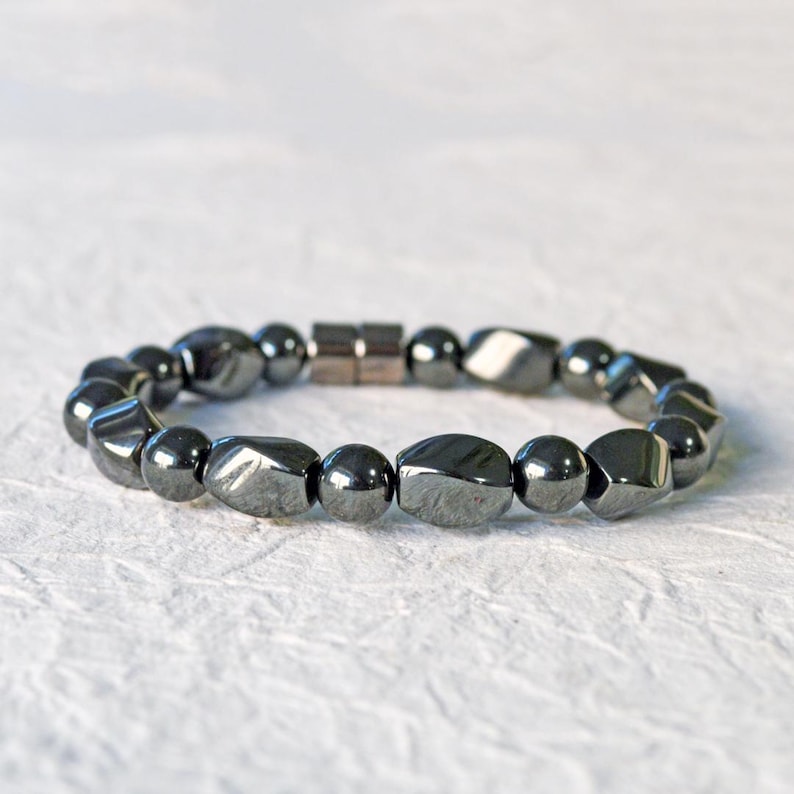 Magnetic bracelet for men handcrafted with high power black hematite magnetic beads. Bracelet is secured with a strong and easy-to-use magnetic clasp.