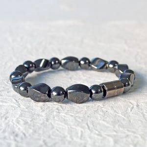 Magnetic bracelet for men handcrafted with high power black hematite magnetic beads. Bracelet is secured with a strong and easy-to-use magnetic clasp.