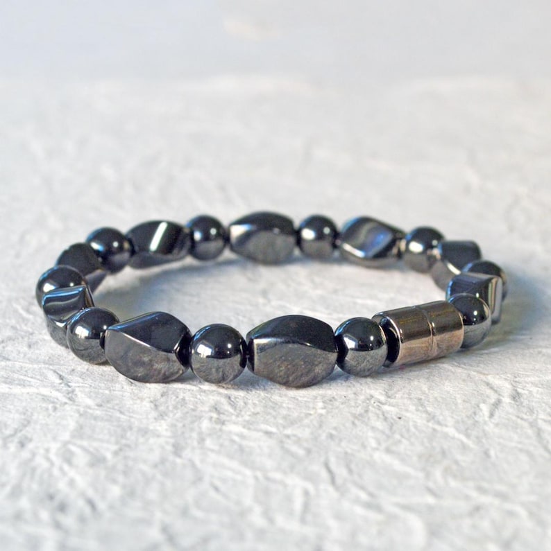 Magnetic bracelet for men handcrafted with high power black hematite magnetic beads. Bracelet is secured with a strong and easy-to-use magnetic clasp.
