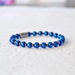 Magnetic bracelet handcrafted with blue metallic magnetic hematite beads. It is secured with a strong and easy-to-use rare earth magnetic clasp. Wear as a magnetic bracelet or magnetic ankle bracelet.
