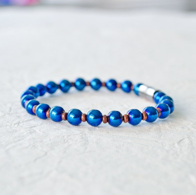 Magnetic bracelet handcrafted with blue metallic magnetic hematite beads. It is secured with a strong and easy-to-use rare earth magnetic clasp. Wear as a magnetic bracelet or magnetic ankle bracelet.