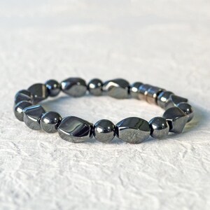 Magnetic bracelet for men handcrafted with high power black hematite magnetic beads. Bracelet is secured with a strong and easy-to-use magnetic clasp.