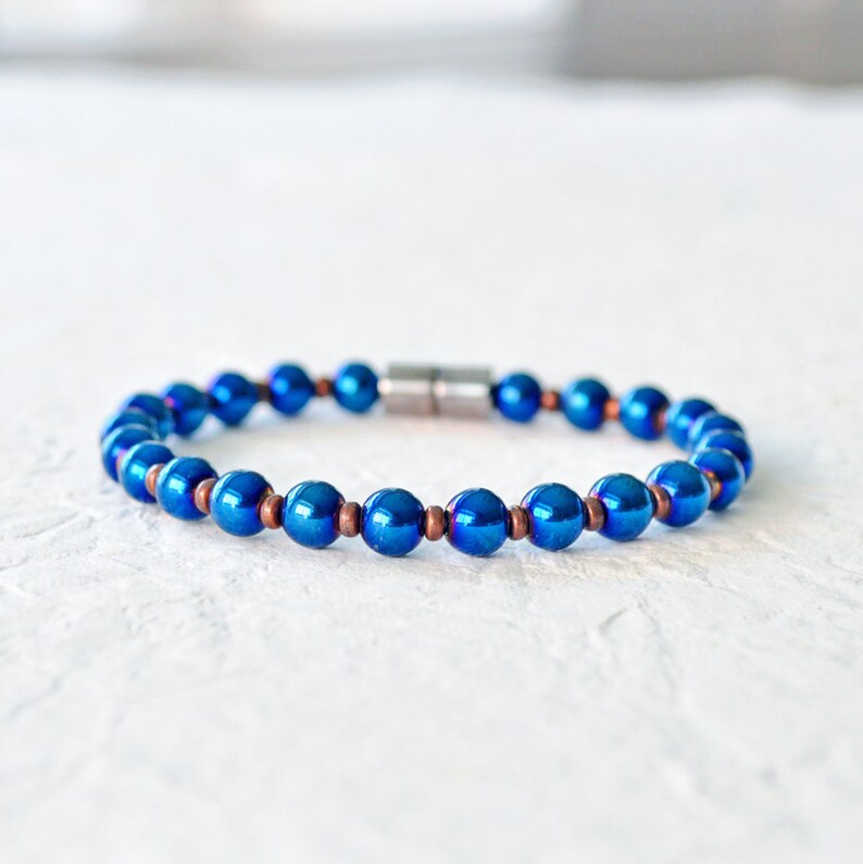 Magnetic bracelet handcrafted with blue metallic magnetic hematite beads. It is secured with a strong and easy-to-use rare earth magnetic clasp. Wear as a magnetic bracelet or magnetic ankle bracelet.