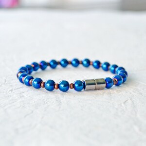 Magnetic bracelet handcrafted with blue metallic magnetic hematite beads. It is secured with a strong and easy-to-use rare earth magnetic clasp. Wear as a magnetic bracelet or magnetic ankle bracelet.