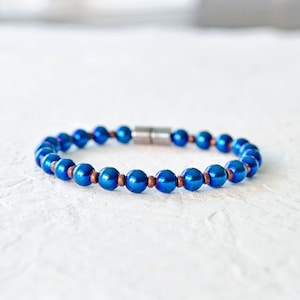 Magnetic bracelet handcrafted with blue metallic magnetic hematite beads. It is secured with a strong and easy-to-use rare earth magnetic clasp. Wear as a magnetic bracelet or magnetic ankle bracelet.
