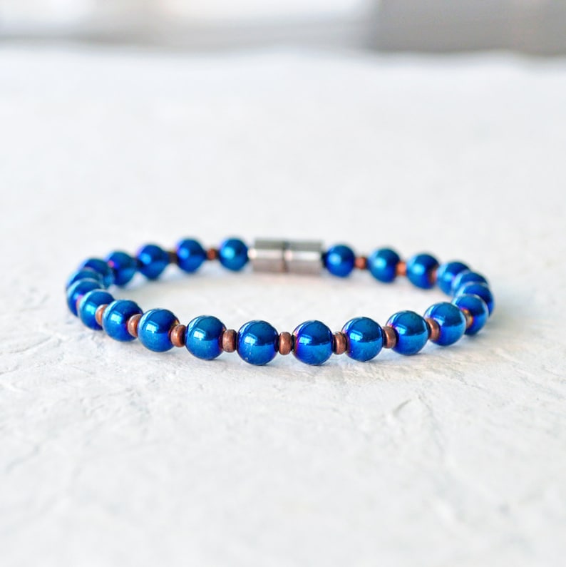 Magnetic bracelet handcrafted with blue metallic magnetic hematite beads. It is secured with a strong and easy-to-use rare earth magnetic clasp. Wear as a magnetic bracelet or magnetic ankle bracelet.