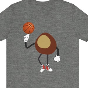 Buckeye de dibujos animados / Jugador de baloncesto / Diseño extravagante / Regalo perfecto / Ropa informal / Tallas para adultos y niños / Ohio Nut