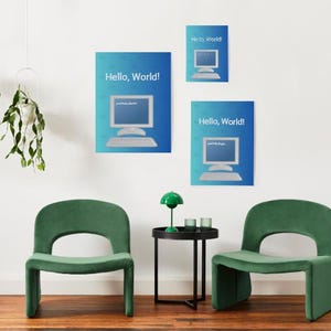 May include: Three blue posters with a computer graphic and the text "Hello, World!" hang on a white wall. Two green chairs and a small black table with a green lamp and two small glasses are in front of the wall.
