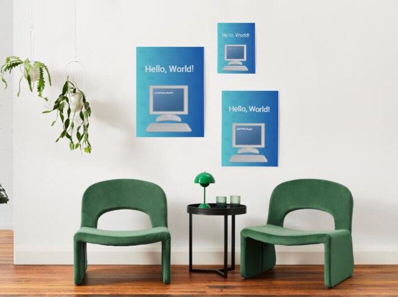 May include: Three blue posters with a computer graphic and the text "Hello, World!" hang on a white wall. Two green chairs and a small black table with a green lamp and two small glasses are in front of the wall.