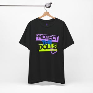 Protect The Dolls Graphic Tee, Unisex T-Shirt, Streetwear Fashion, Gift for Doll Collectors, Cute Apparel, Casual Wear