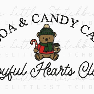 May include: An embroidered design featuring a brown teddy bear wearing a green hat and scarf, holding a candy cane and a coffee cup. The text reads "COCOA & CANDY CANES" and "Joyful Hearts Club".
