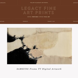May include: Abstract art print in black, white, and beige tones. The print features a large, abstract shape in the center, with smaller shapes surrounding it. The print is framed in a simple black frame. SAMSUNG Frame TV Digital Artwork.