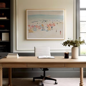 May include: A light wood desk with a white office chair, a framed beach scene painting, and a vase with green leaves and a white vase on top of the desk.