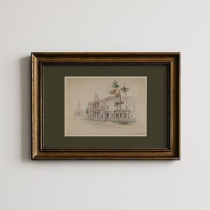 Puede incluir: Una pintura de acuarela enmarcada de un edificio con un campanario al fondo. La pintura está en un marco verde oscuro y un marco dorado. La obra de arte representa un edificio con columnas y un árbol con hojas verdes y naranjas.