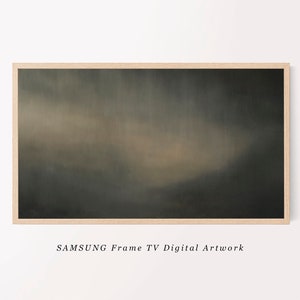 May include: A framed abstract painting with a dark green and brown color scheme. The painting features a soft, blurred effect, creating a sense of depth and movement. The frame is a simple, light wood.