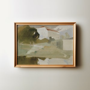 May include: A framed painting depicting a landscape with a white building with a red roof, green trees, and a body of water in the foreground. The painting is done in a muted color palette with shades of green, brown, and blue.