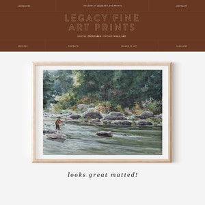 May include: A watercolor painting of a man fly fishing in a river surrounded by trees and rocks. The painting is framed in a light wood frame.