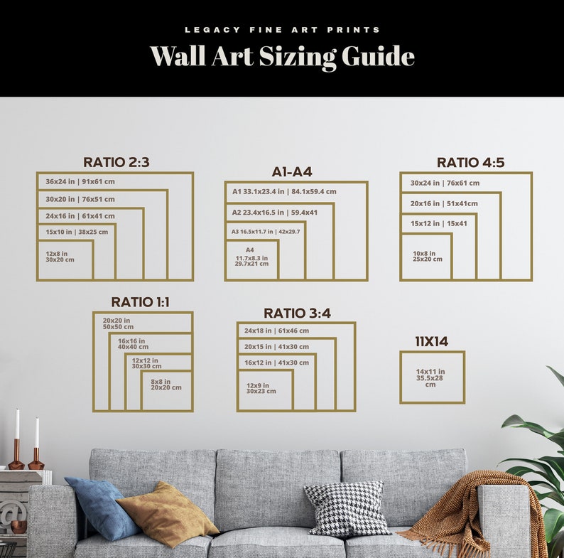 May include: A wall art sizing guide with different ratios and sizes in inches and centimeters. The guide includes ratios like 2:3, 1:1, 3:4, 4:5, and 11x14. The guide is displayed on a white wall with a brown couch in the foreground.